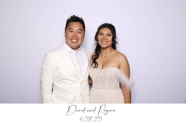 Bride and groom smiling together in the Glam photo booth